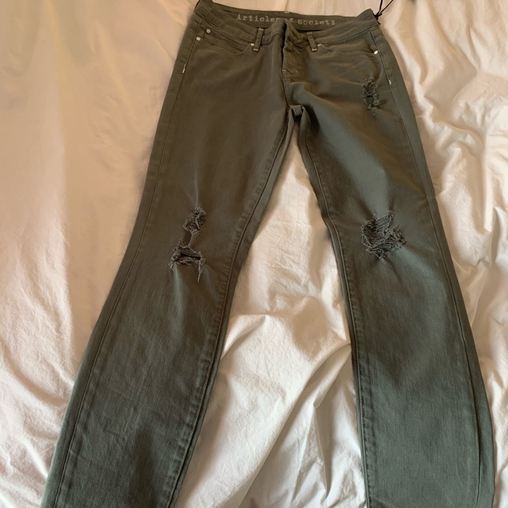 Slightly destructed straight leg mid rise denim